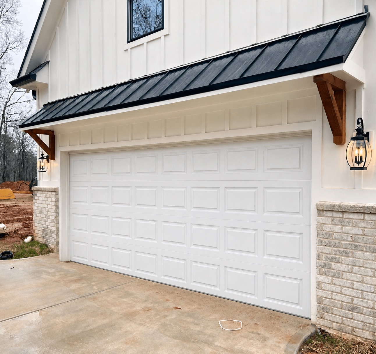 Plain white builder-grade garage door before replacement